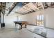 Unfinished basement with exposed ceiling, a pool table, and a walkout to the backyard at 4807 River Highlands Loop, Elizabeth, CO 80107