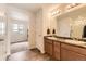 Bathroom boasting double sinks, granite countertops, and a separate toilet area at 4807 River Highlands Loop, Elizabeth, CO 80107