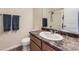 Well-lit bathroom featuring a single sink vanity and a shower-tub combination at 4807 River Highlands Loop, Elizabeth, CO 80107
