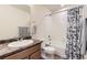 Well-maintained bathroom with a decorative shower curtain and modern fixtures at 4807 River Highlands Loop, Elizabeth, CO 80107