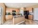 Spacious kitchen featuring an island, black appliances, and ample cabinetry at 4807 River Highlands Loop, Elizabeth, CO 80107