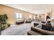 Expansive living space bathed in natural light, seamlessly connecting to the kitchen and dining area, great for entertaining at 4807 River Highlands Loop, Elizabeth, CO 80107