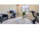 Bright office space with a modern desk, comfortable chair, and exercise equipment for convenient workouts at 4807 River Highlands Loop, Elizabeth, CO 80107