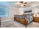 Cozy bedroom featuring soft carpet, a full bed, neutral walls, and a window for natural light at 8985 W Quarto Pl, Littleton, CO 80128