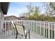 Inviting outdoor deck with chairs, offering a relaxing space to enjoy the view of the backyard and landscaping at 12235 Garfield Pl, Thornton, CO 80241