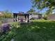 Spacious backyard featuring a gazebo, well-maintained lawn, and a charming back porch at 12235 Garfield Pl, Thornton, CO 80241