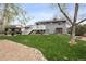 Expansive backyard with lush green grass, a stone pathway, and a charming gazebo for outdoor enjoyment at 12235 Garfield Pl, Thornton, CO 80241