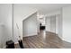 Finished basement featuring hardwood floors and an electric guitar at 12235 Garfield Pl, Thornton, CO 80241