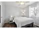 Bright bedroom with a large window, ceiling fan, and wood floors at 12235 Garfield Pl, Thornton, CO 80241