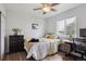 Bright bedroom features hardwood floors, a large window, and neutral decor at 12235 Garfield Pl, Thornton, CO 80241
