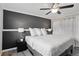 Bedroom featuring a ceiling fan, wood floors, and neutral decor at 12235 Garfield Pl, Thornton, CO 80241