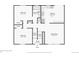 First floor plan featuring two bedrooms, a bathroom, a kitchen, and a living room, with stairs to the entry at 12235 Garfield Pl, Thornton, CO 80241