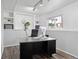 Office space featuring track lighting, built in shelves and hardwood floors at 12235 Garfield Pl, Thornton, CO 80241