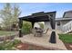Stylish outdoor patio with a gazebo, perfect for entertaining guests and enjoying outdoor meals at 12235 Garfield Pl, Thornton, CO 80241
