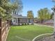 Spacious backyard with a lush lawn, a screened-in porch, and a patio, perfect for relaxing and entertaining at 4747 S Elati St, Englewood, CO 80110