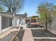 Charming backyard featuring a patio area, lush landscaping, and a wooden pathway, creating a serene outdoor retreat at 4747 S Elati St, Englewood, CO 80110