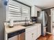 Bright kitchen featuring stainless steel appliances, subway tile backsplash, and hardwood floors at 4747 S Elati St, Englewood, CO 80110