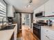 Updated kitchen with stainless steel appliances and hardwood floors at 4747 S Elati St, Englewood, CO 80110