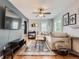 Bright living room with hardwood floors, neutral paint, and lots of natural light at 4747 S Elati St, Englewood, CO 80110
