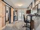 Versatile home office with neutral paint, sliding barn door, and French doors to the exterior at 4747 S Elati St, Englewood, CO 80110