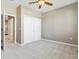 Bright bedroom with double doors leading to a spacious closet at 12337 W Gould Ave, Littleton, CO 80127