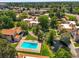 Aerial view of community featuring a swimming pool, pond, landscaping and surrounding neighborhood at 2678 S Xanadu Way # C, Aurora, CO 80014