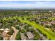 Scenic aerial view of community with lush greenery, golf course and mountain views in the distance at 2678 S Xanadu Way # C, Aurora, CO 80014