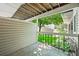Inviting back patio area with lush green views, perfect for outdoor relaxation and enjoying nature at 2678 S Xanadu Way # C, Aurora, CO 80014