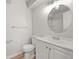 Well-lit bathroom with a stylish vanity, round mirror, and coordinated fixtures, offering a refreshing space at 2678 S Xanadu Way # C, Aurora, CO 80014