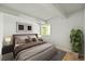 Serene bedroom with neutral tones, soft bedding, and a large window for natural light at 2678 S Xanadu Way # C, Aurora, CO 80014