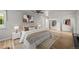 Spacious bedroom featuring ample closet space and a beautifully decorated bed with soft lighting at 2678 S Xanadu Way # C, Aurora, CO 80014