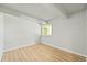 Bright and airy bedroom with natural light, featuring wood flooring and neutral walls, ready for personalization at 2678 S Xanadu Way # C, Aurora, CO 80014