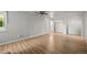 Spacious bedroom with hardwood floors, a ceiling fan, and ample closet space for storage at 2678 S Xanadu Way # C, Aurora, CO 80014
