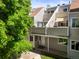 Inviting townhome featuring neutral siding, a private entrance, and a cozy covered porch at 2678 S Xanadu Way # C, Aurora, CO 80014