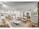 Inviting living space featuring a modern kitchen, cozy seating, and wood flooring at 2678 S Xanadu Way # C, Aurora, CO 80014
