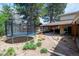 Large backyard features a trampoline, covered patio, and mature trees at 5925 E Fair Ave, Centennial, CO 80111