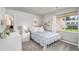 Well-lit bedroom features plush carpet, a large window with a view, and ample storage at 5925 E Fair Ave, Centennial, CO 80111