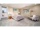 Cozy bedroom featuring neutral tones, plush carpeting and a private outdoor patio at 5925 E Fair Ave, Centennial, CO 80111