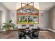 Bright dining room features a vaulted ceiling and large wood-framed window with views of the outdoors at 5925 E Fair Ave, Centennial, CO 80111