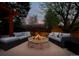Outdoor patio with brick fire pit and cushioned seating, perfect for entertaining on cool evenings at 5925 E Fair Ave, Centennial, CO 80111