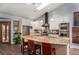 Bright, open kitchen featuring stainless steel appliances and a large center island with seating at 5925 E Fair Ave, Centennial, CO 80111