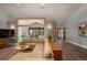 Open concept living room with modern decor, wood flooring and a large comfortable sectional couch at 5925 E Fair Ave, Centennial, CO 80111