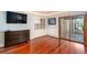 Bright living room features cherry floors, a built-in bookshelf and recessed lights at 5925 E Fair Ave, Centennial, CO 80111