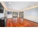 Spacious living room with hardwood floors and sliding glass doors to the backyard at 5925 E Fair Ave, Centennial, CO 80111