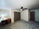 This bedroom has carpeted floors and a ceiling fan, creating a comfortable and relaxing space at 690 Antelope Dr, Bennett, CO 80102