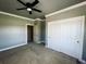 Bedroom features carpet and a roomy closet with double doors and easy access to other rooms at 690 Antelope Dr, Bennett, CO 80102