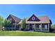 Charming two-story home with a welcoming front porch and a beautifully landscaped front yard at 690 Antelope Dr, Bennett, CO 80102