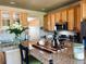 Kitchen with stainless appliances, granite counters, breakfast bar, and decorative elements at 690 Antelope Dr, Bennett, CO 80102