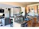Kitchen featuring granite countertops, modern appliances, and open layout for entertaining at 690 Antelope Dr, Bennett, CO 80102