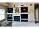 Elegant fireplace with mantle and decorative built-ins for storage and display at 690 Antelope Dr, Bennett, CO 80102